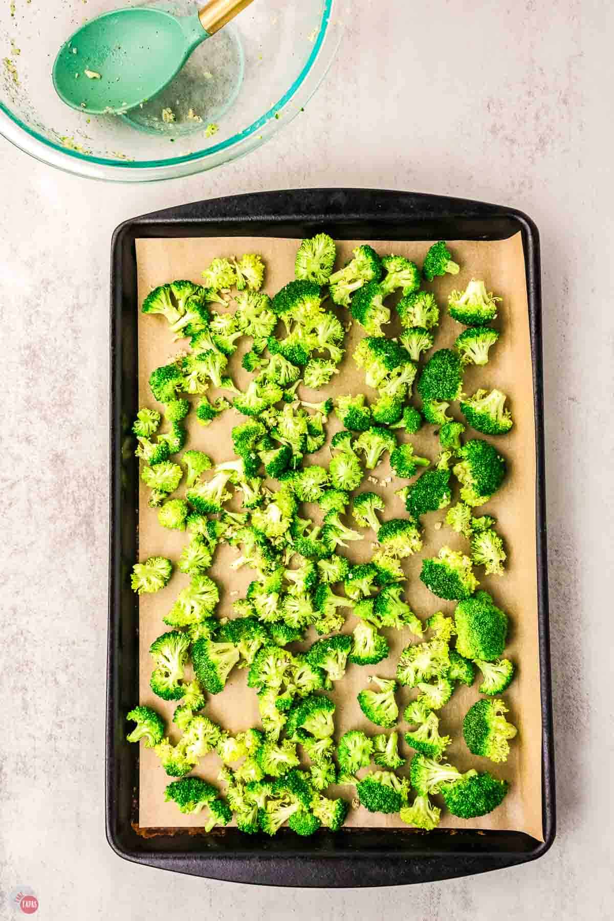 broccoli florets on a baking with parchment paper