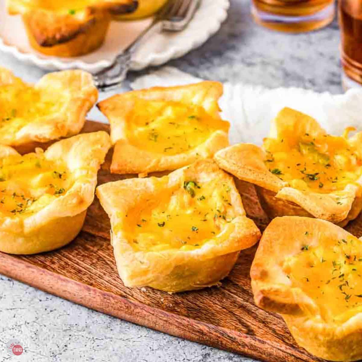 board topped with mini chicken pot pies