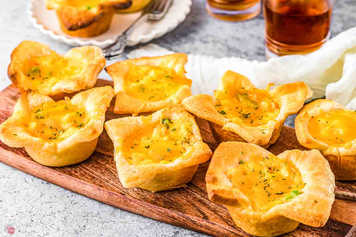 wood board with mini pot pies on it