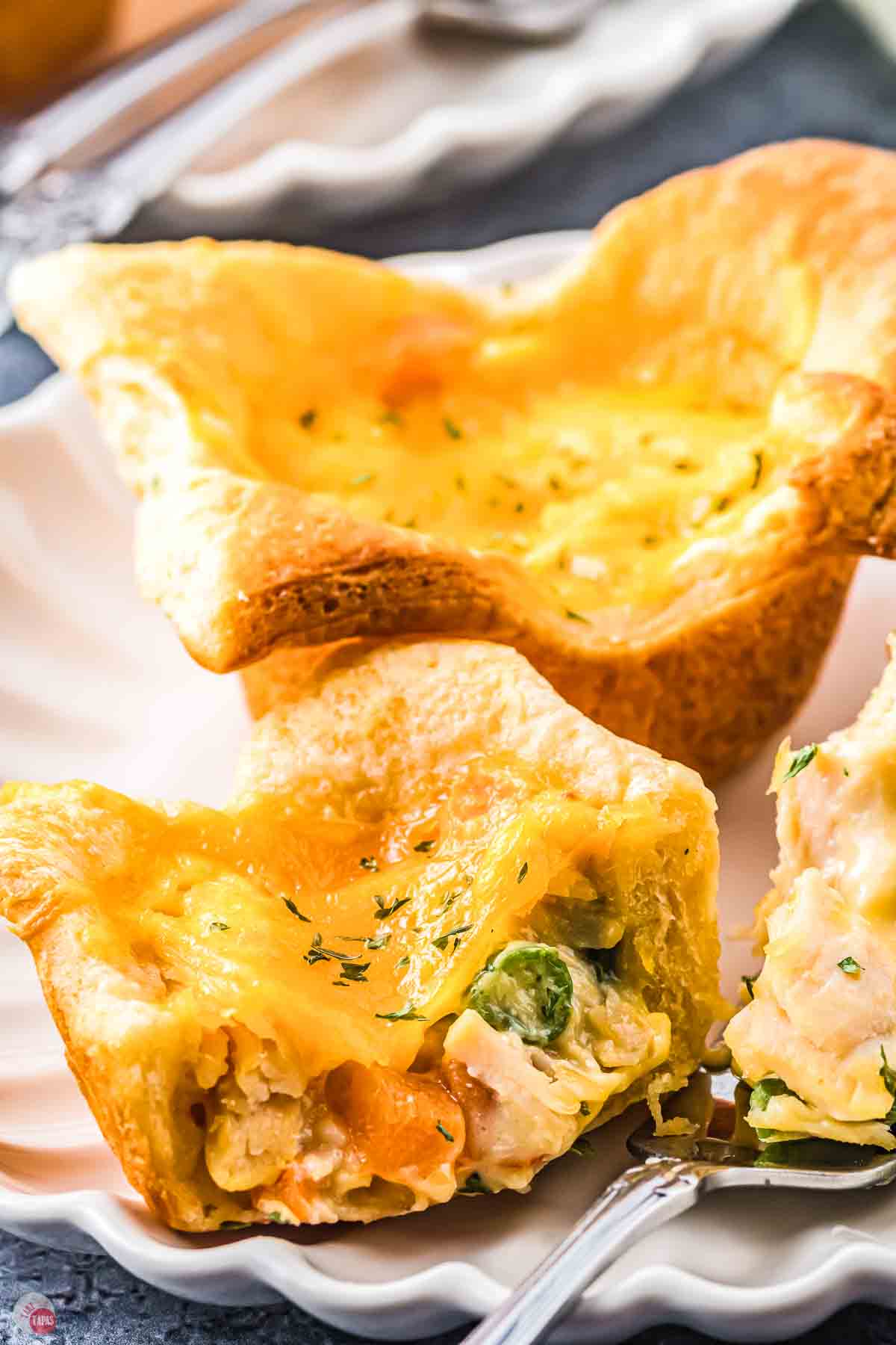 mini pot pie cut in half on a plate