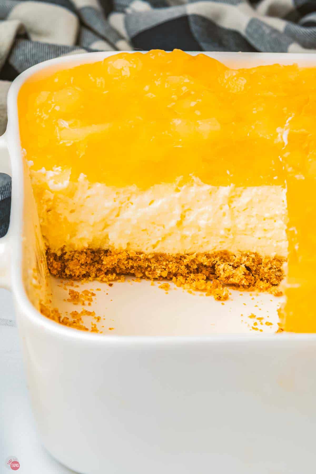 close up of layered dessert salad with a slice missing so you can see the layers