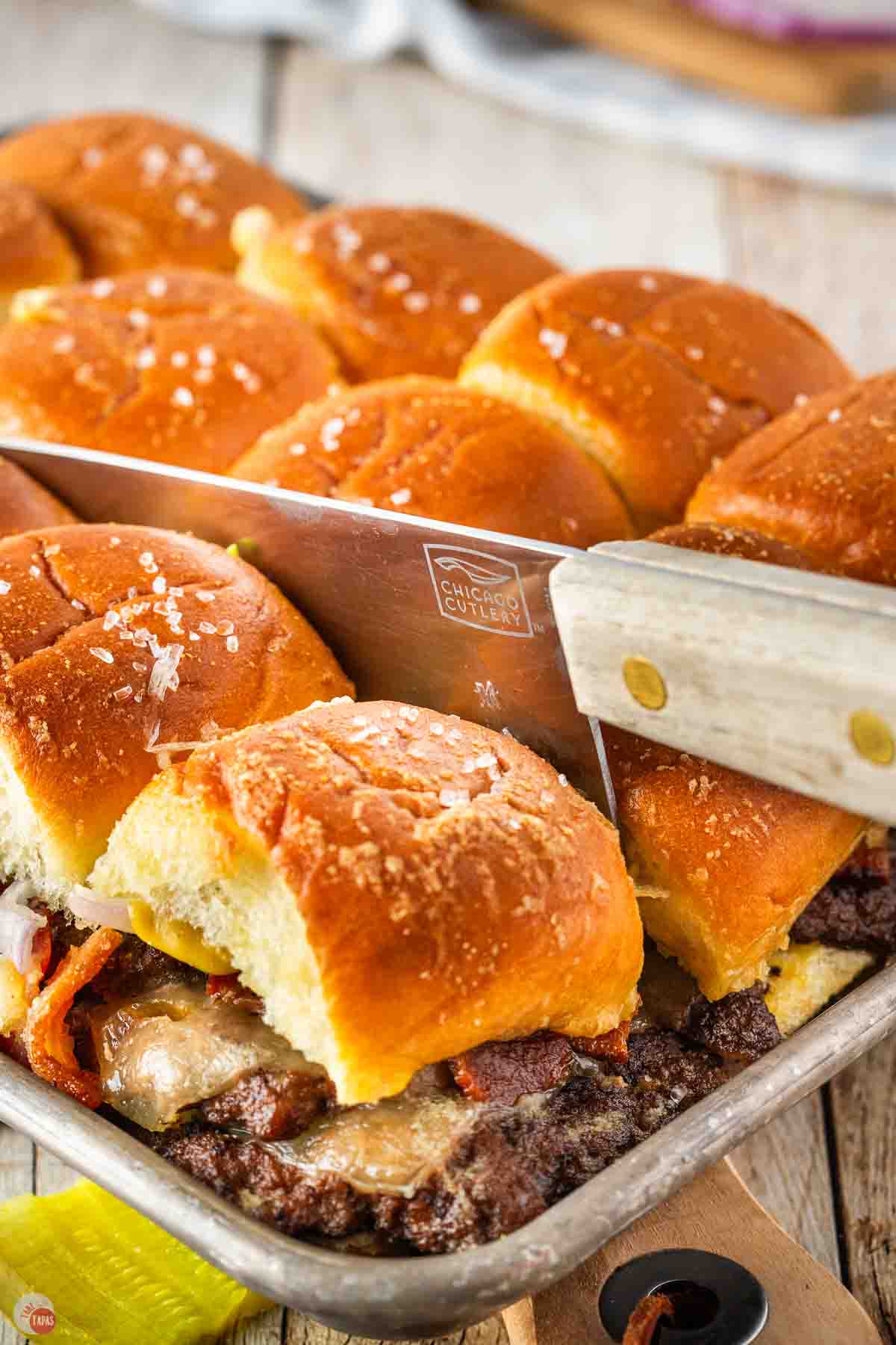 knife slicing through smash burger sliders