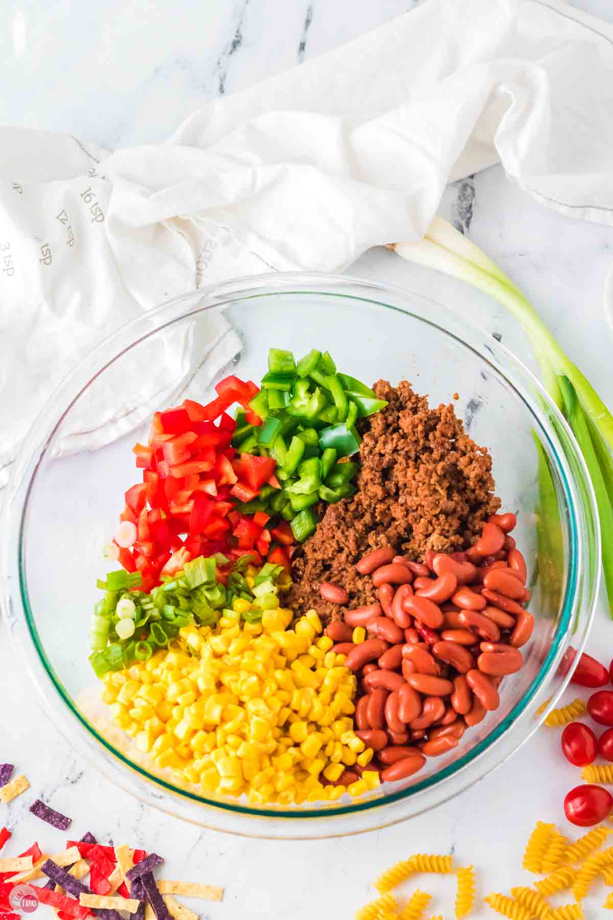 clear bowl with chopped vegetables in it