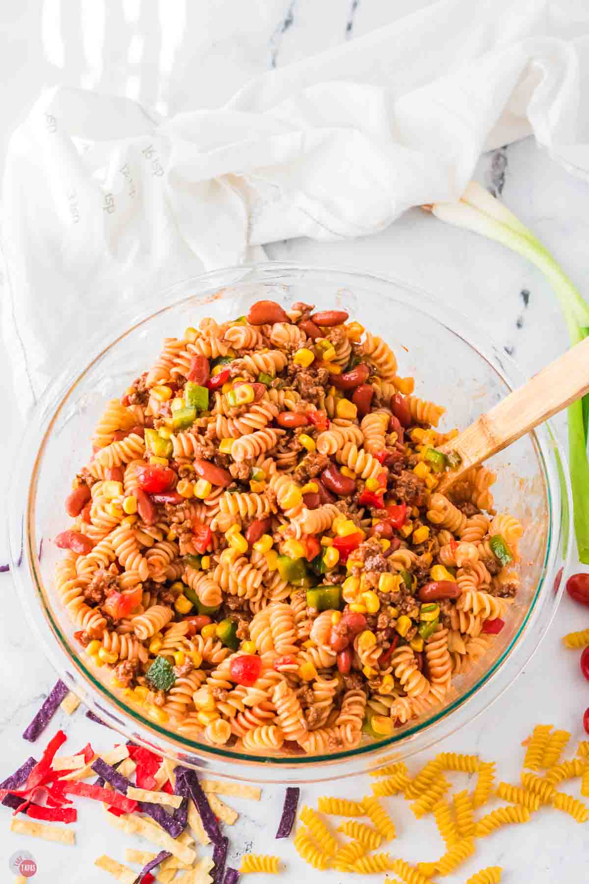 clear bowl of taco pasta salad