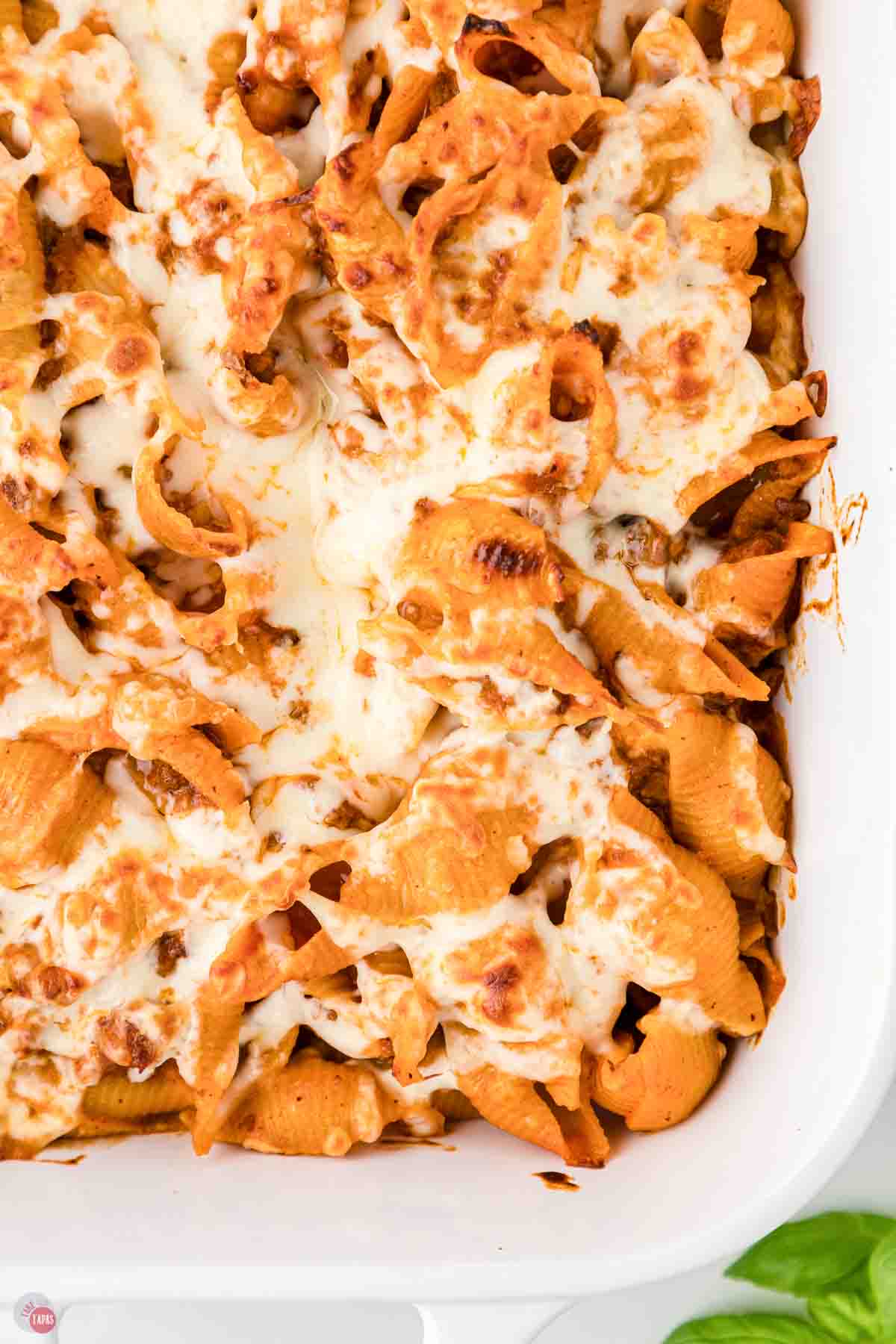 close up of baked casserole in a white dish