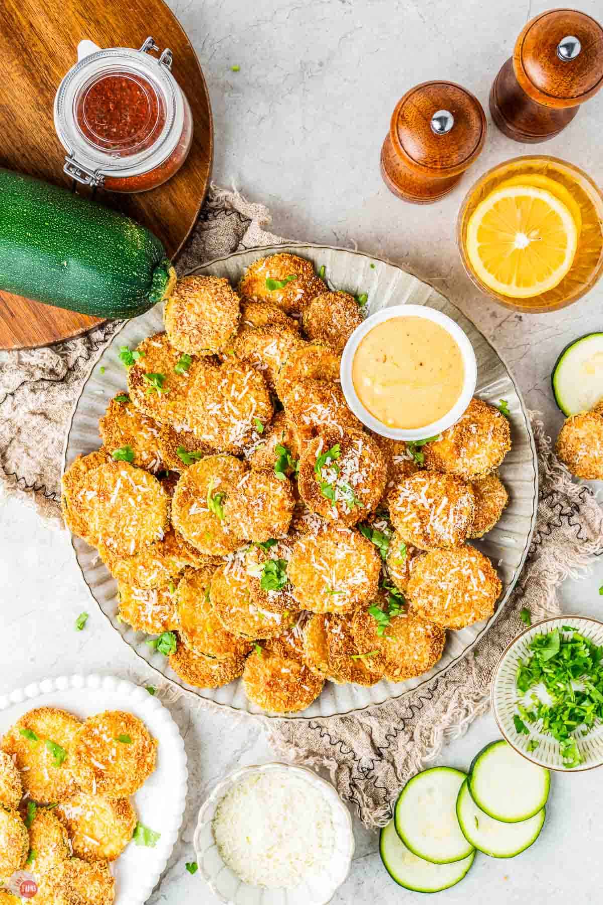 plate of air fryer zucchini chips with dipping sauce