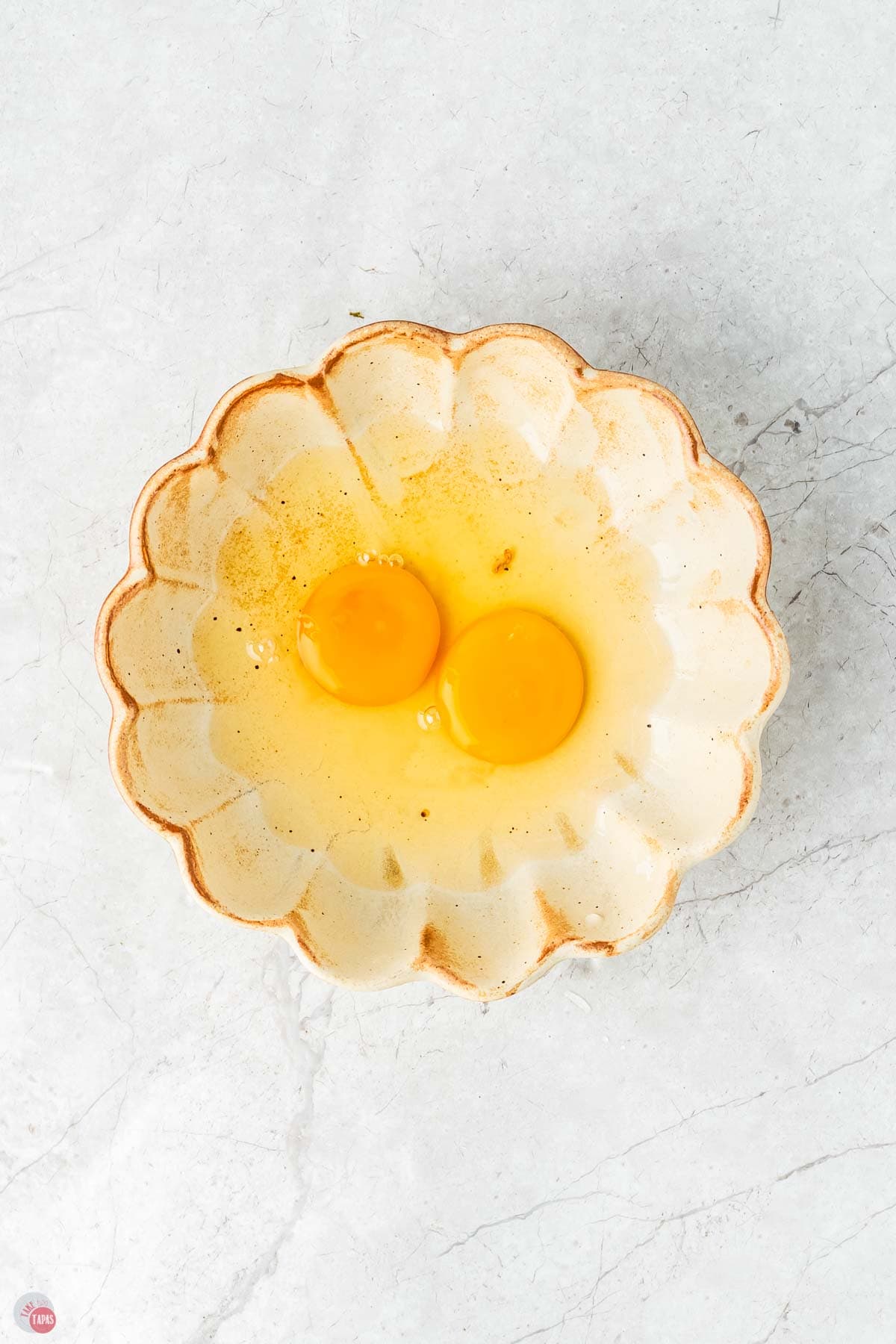 two eggs in a shallow bowl
