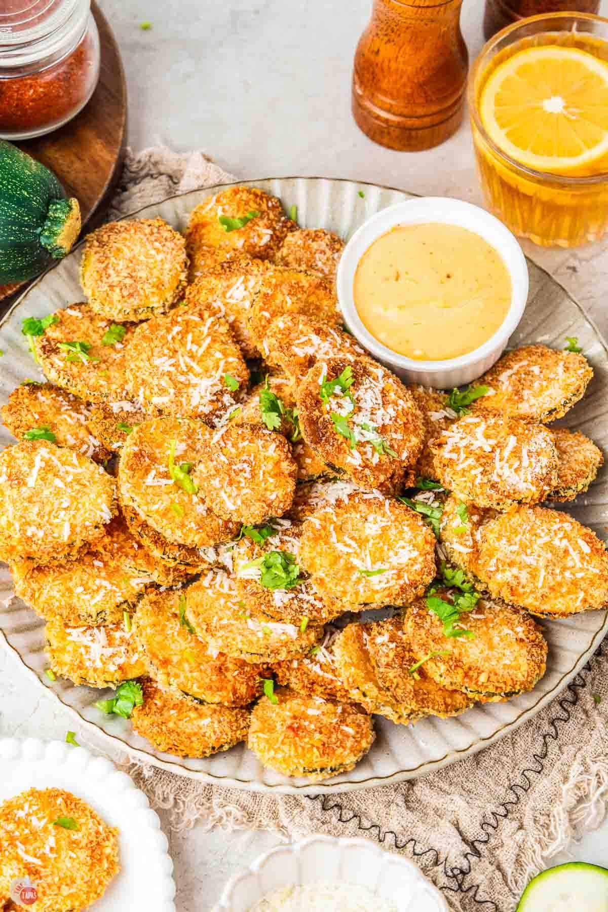 plate of air fried zucchini with a crispy panko coating