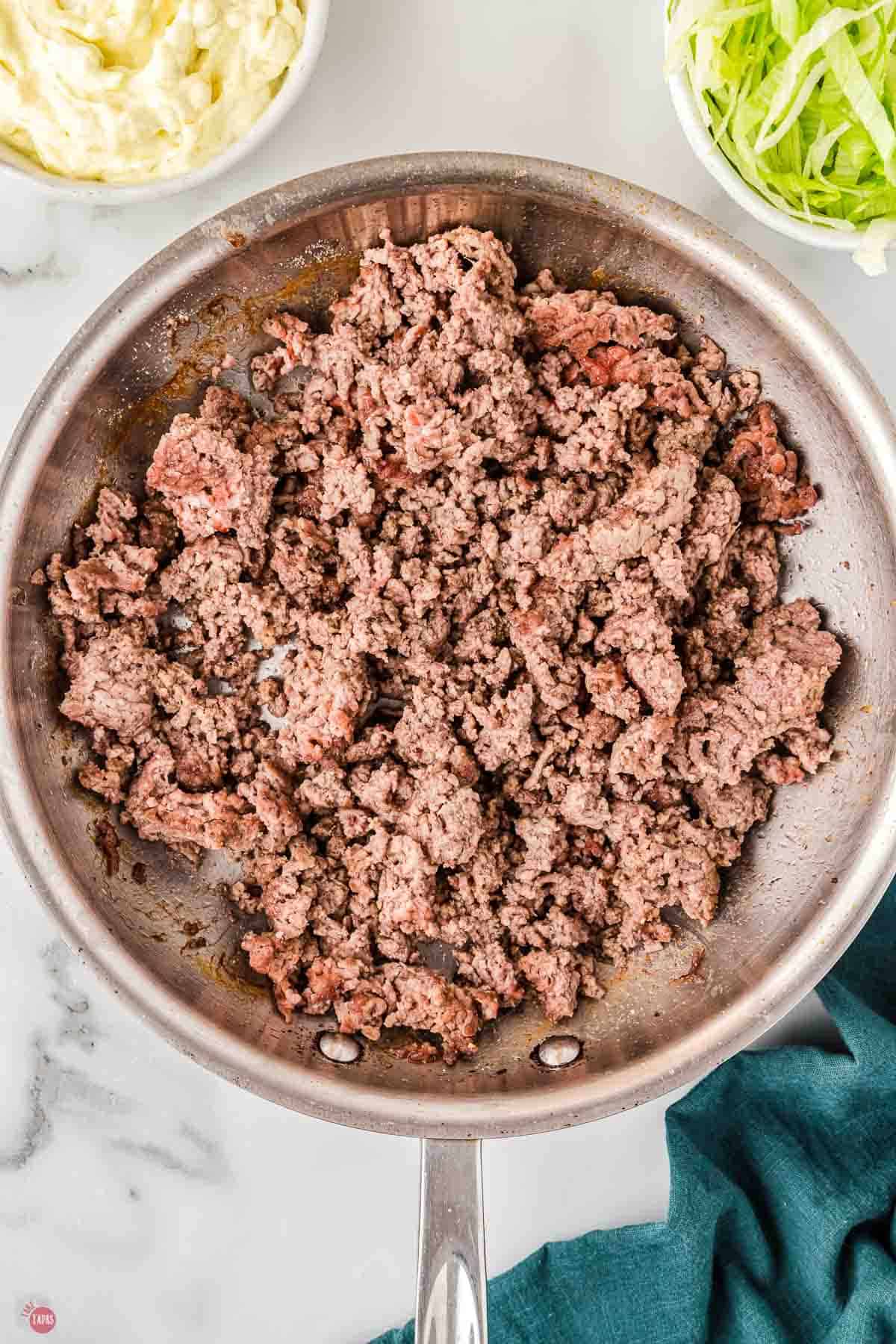 ground beef cooked in a skillet