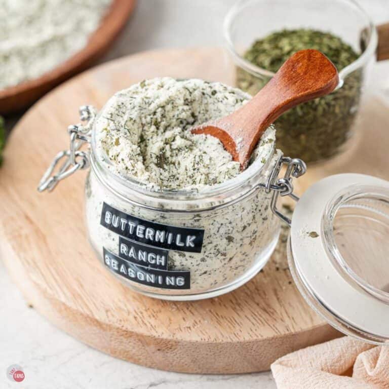 jar of homemade ranch seasoning with a small wood spoon