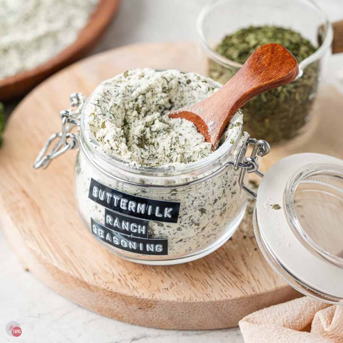 jar of homemade ranch seasoning with a small wood spoon