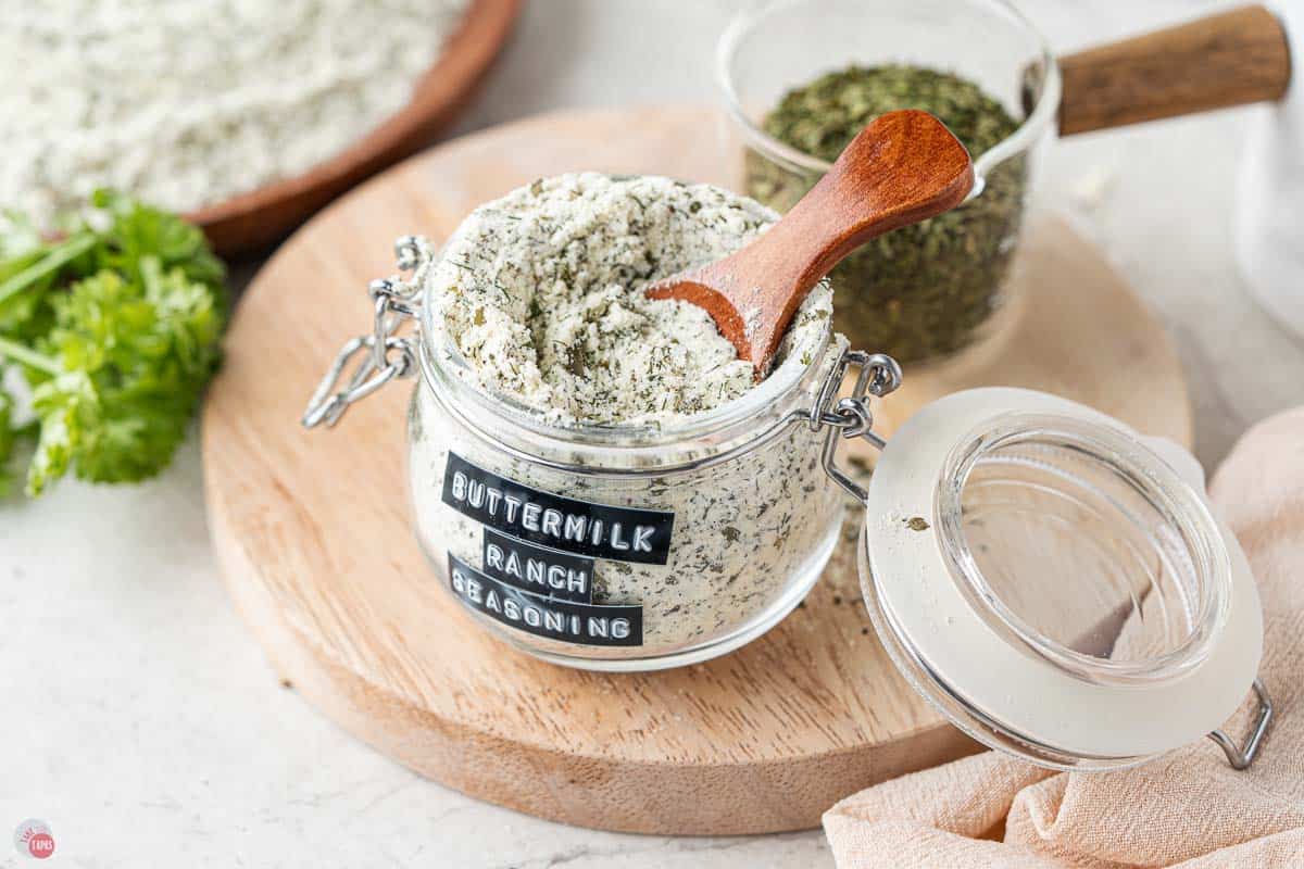 jar of buttermilk ranch seasoning with a small wood spoon