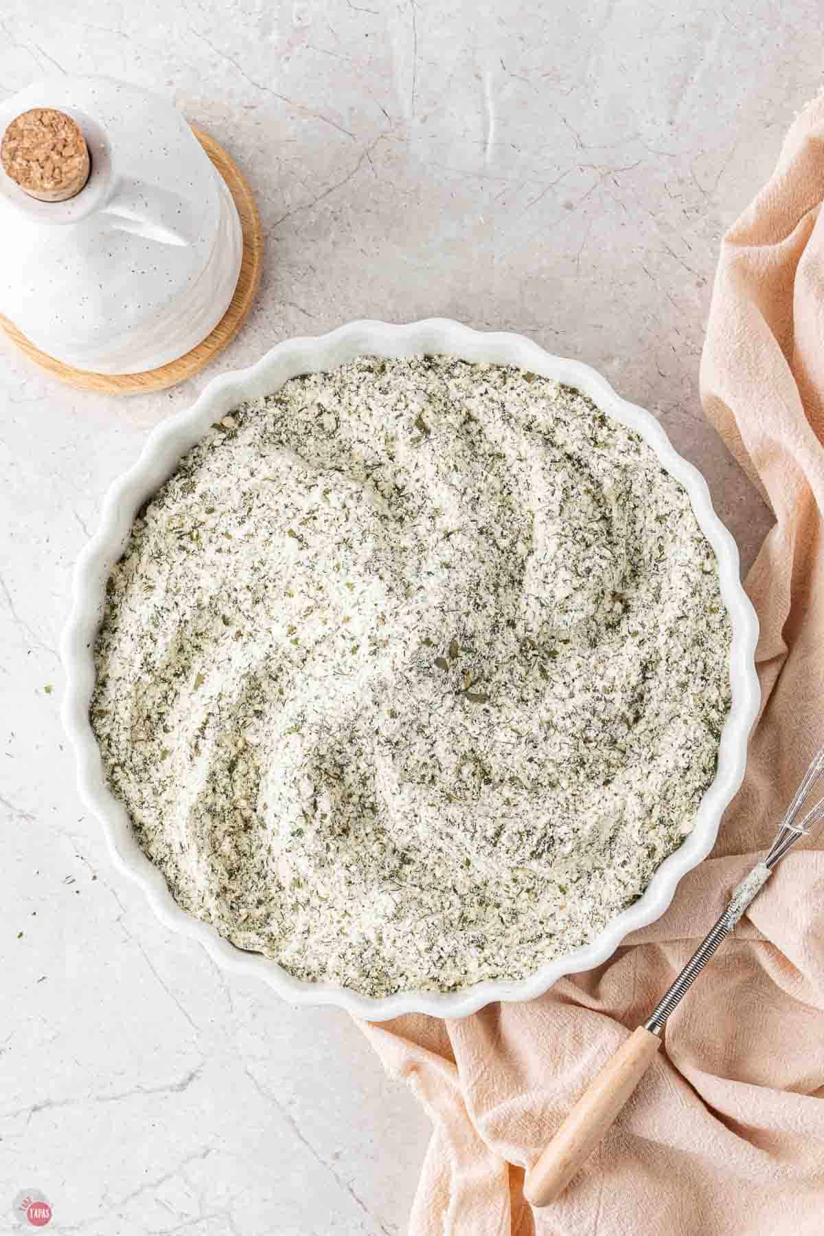white bowl with buttermilk ranch seasoning spices mixed together