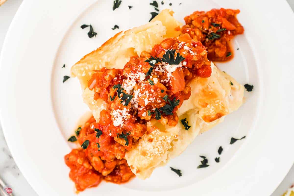 overhead picture of baked rigatoni topped with a ground chicken meat sauce