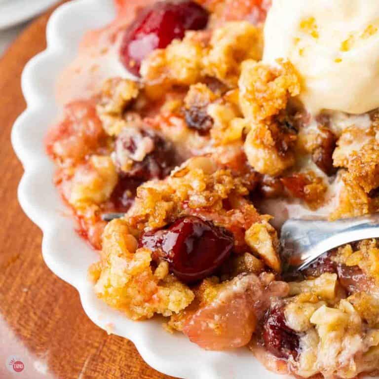 close up of bowl of cherry cake with ice cream
