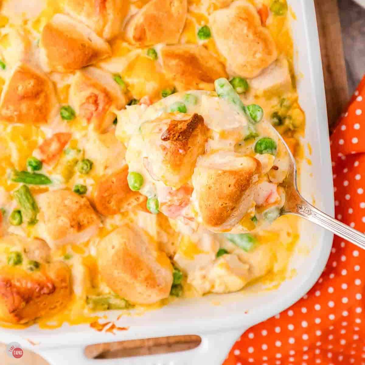 spoon scooping chicken casserole out of a dish