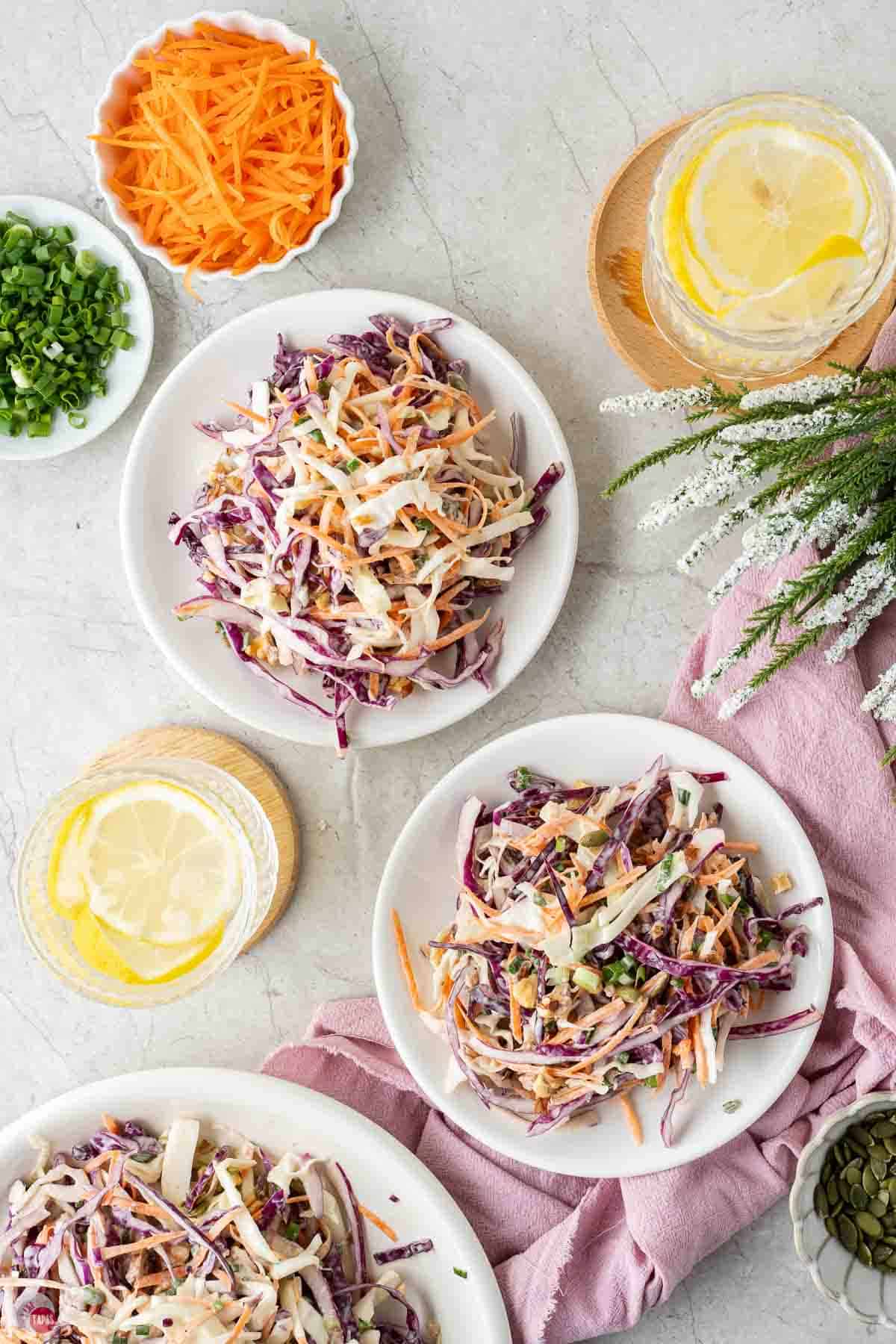 three bowls of coleslaw