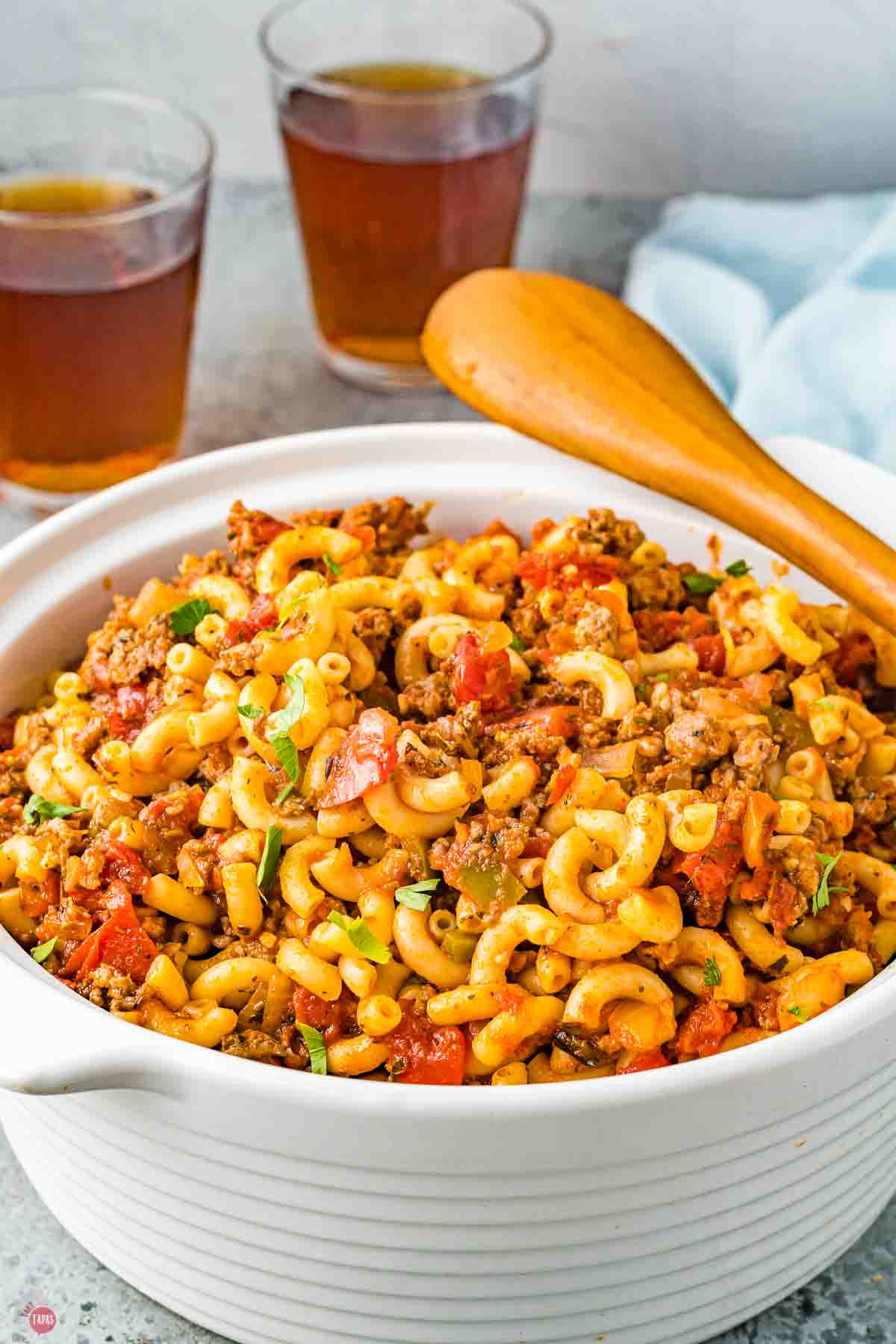 bowl of goulash with a wood spoon