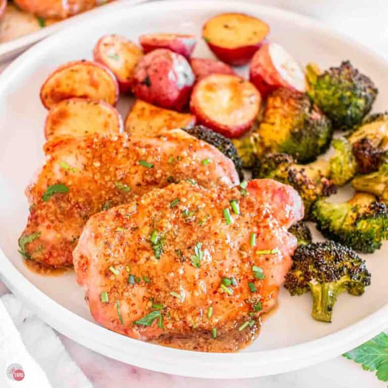 pork chops, potatoes, and broccoli on a plate