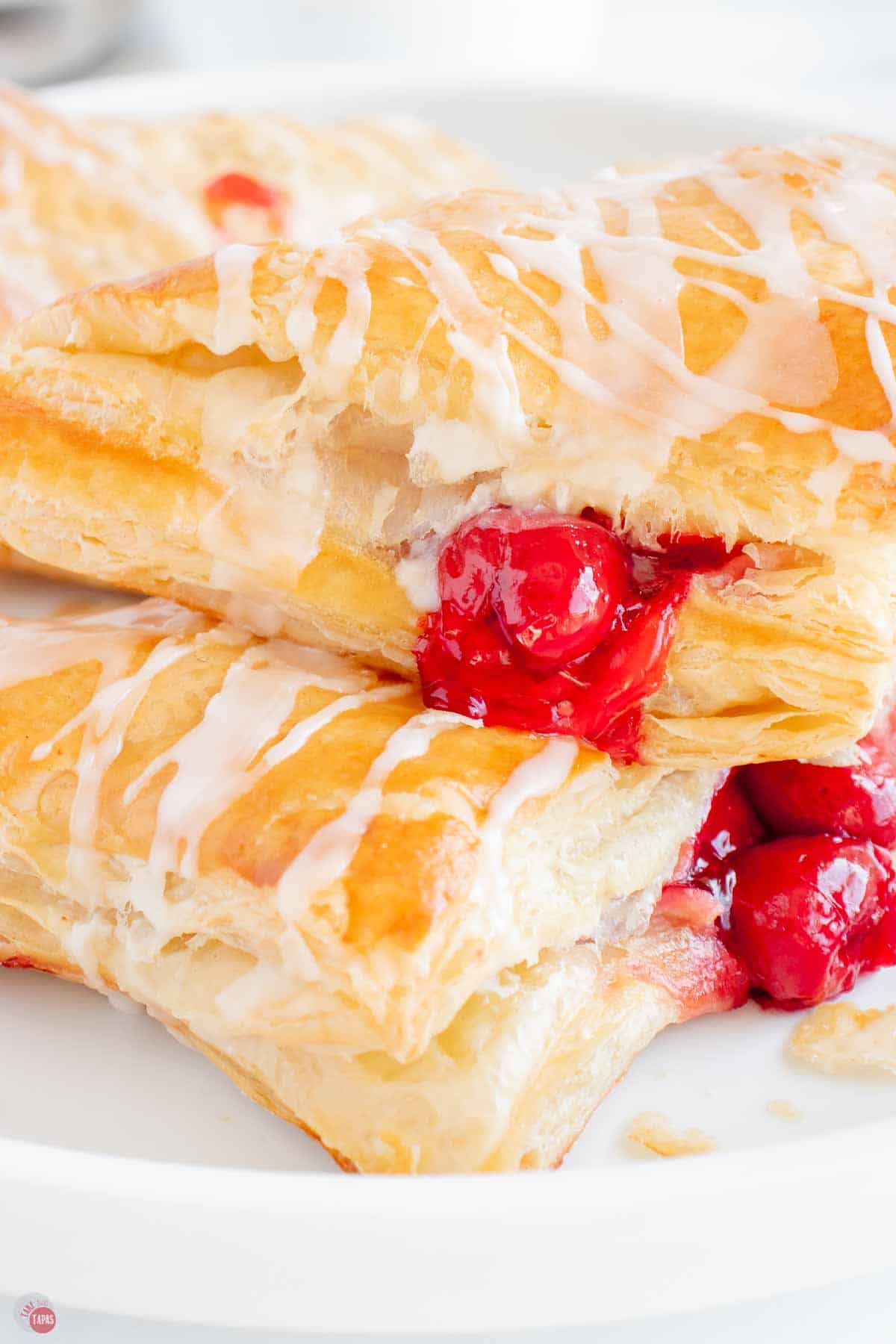 close up of side view of puff pastry cherry turnovers