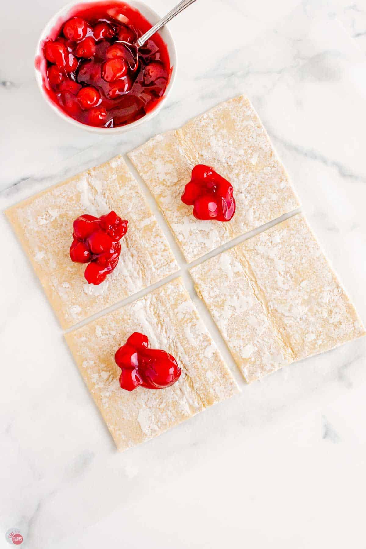 puff pastry cut into 4 squares and topped with a dollop of cherry pie filling