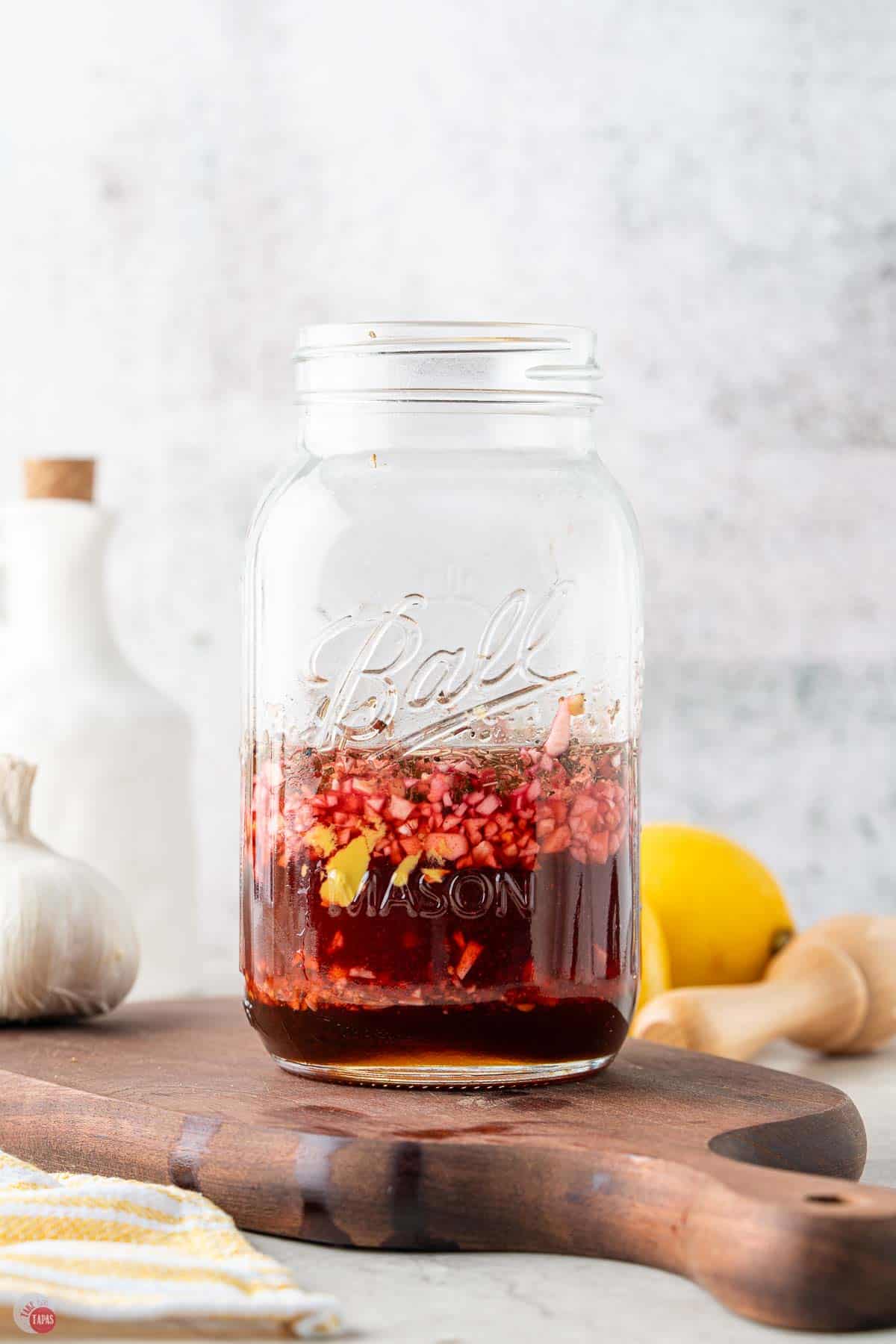 dressing ingredients layered in a mason jar