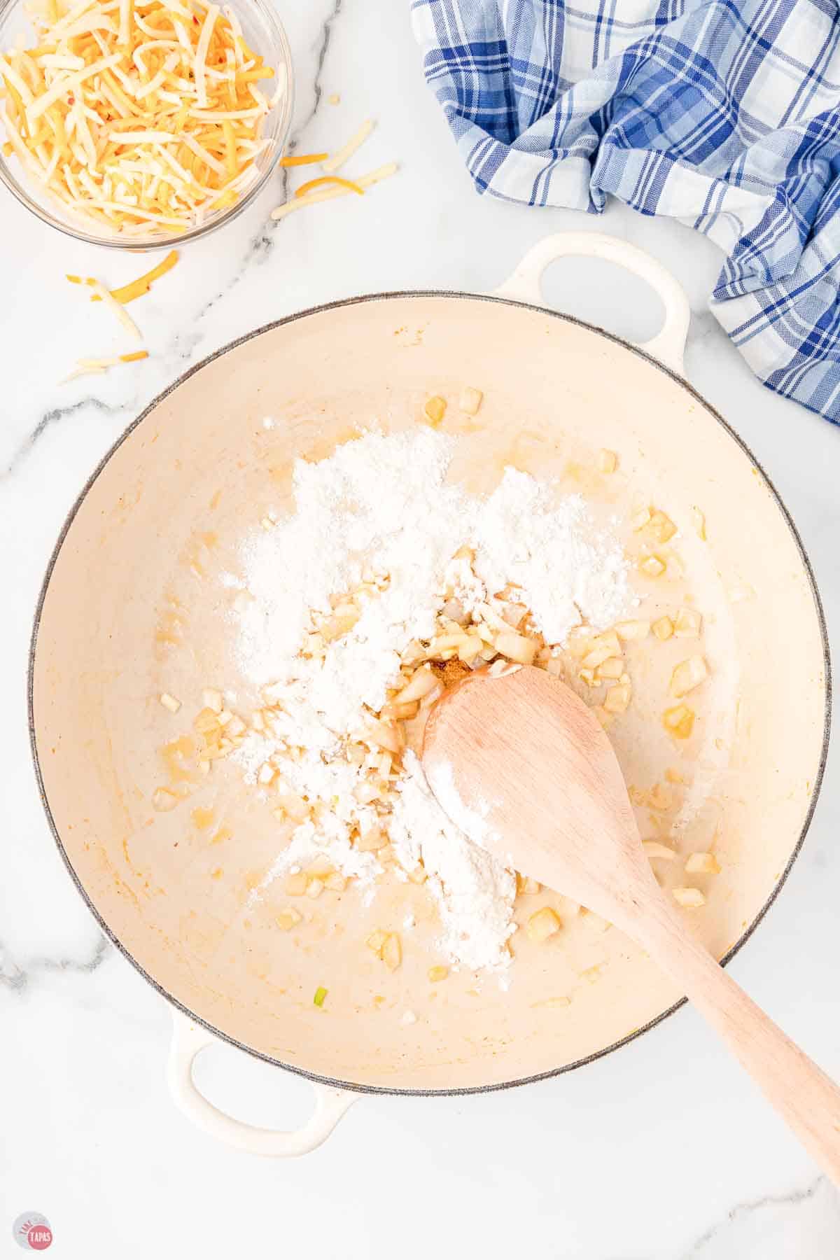 skillet with flour, butter, and onions cooking
