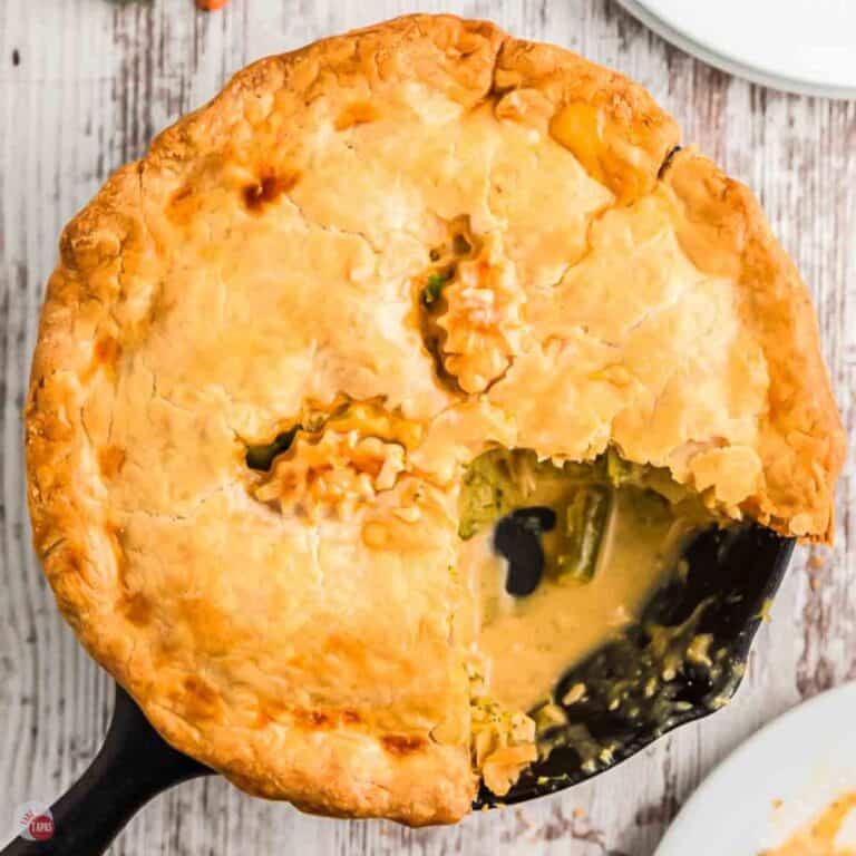 cast iron skillet chicken pot pie with a wedge missing