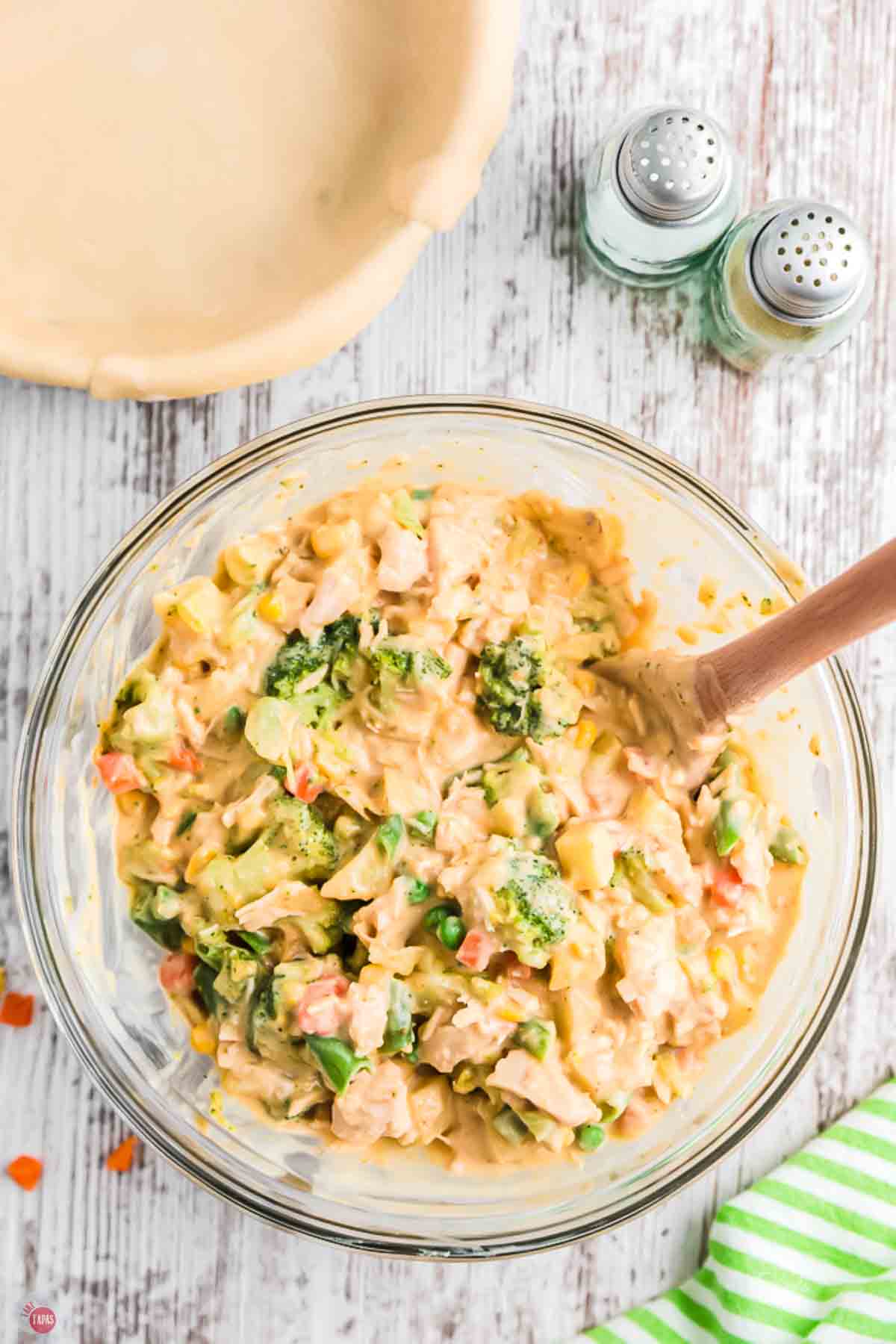 mixing bowl filled with chicken, vegetables, and condensed soup