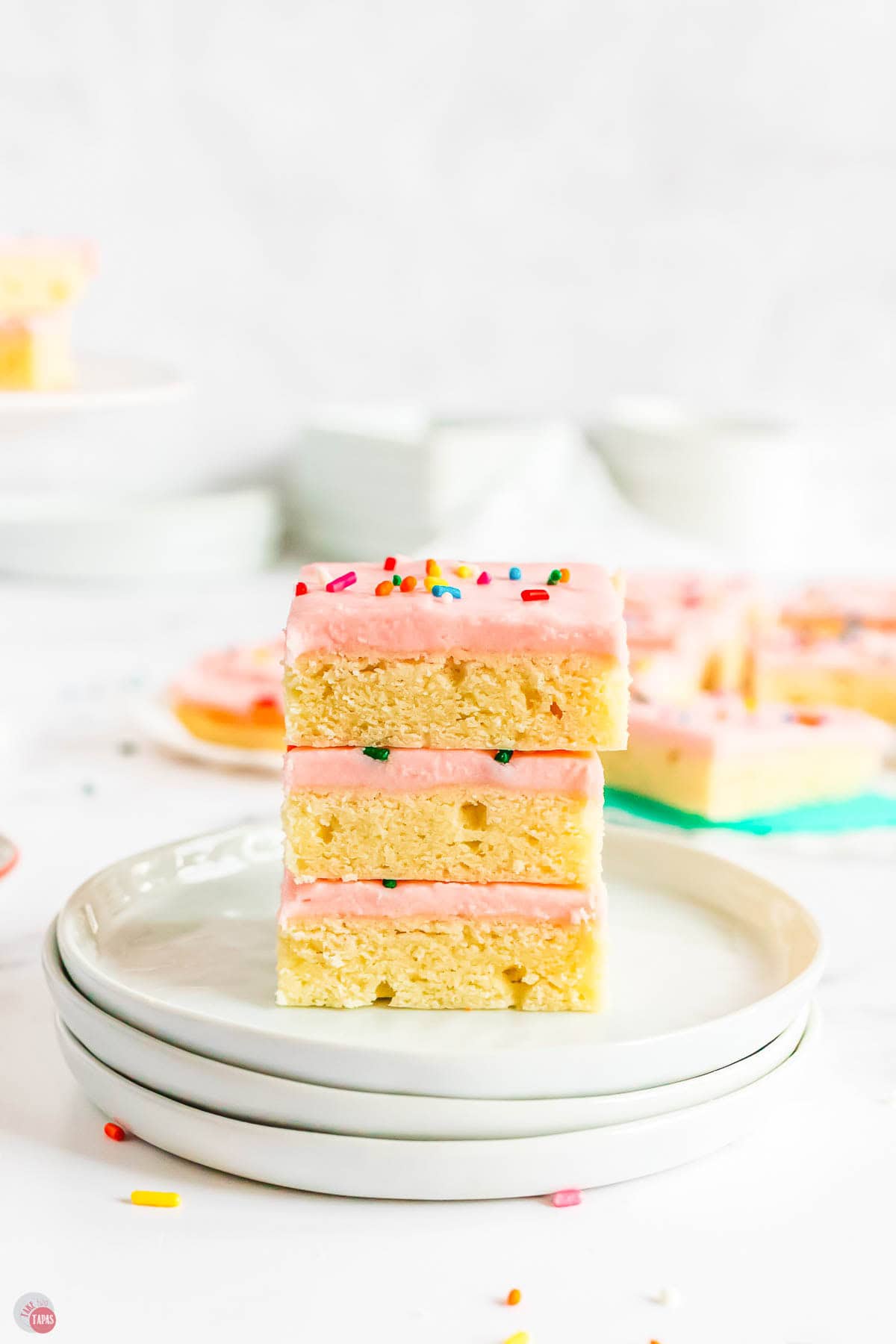 stack of sugar cookie bars on a a stack of plates