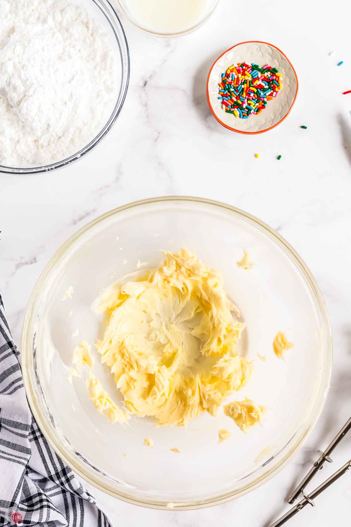 butter and sugar creamed together in a clear mixing bowl