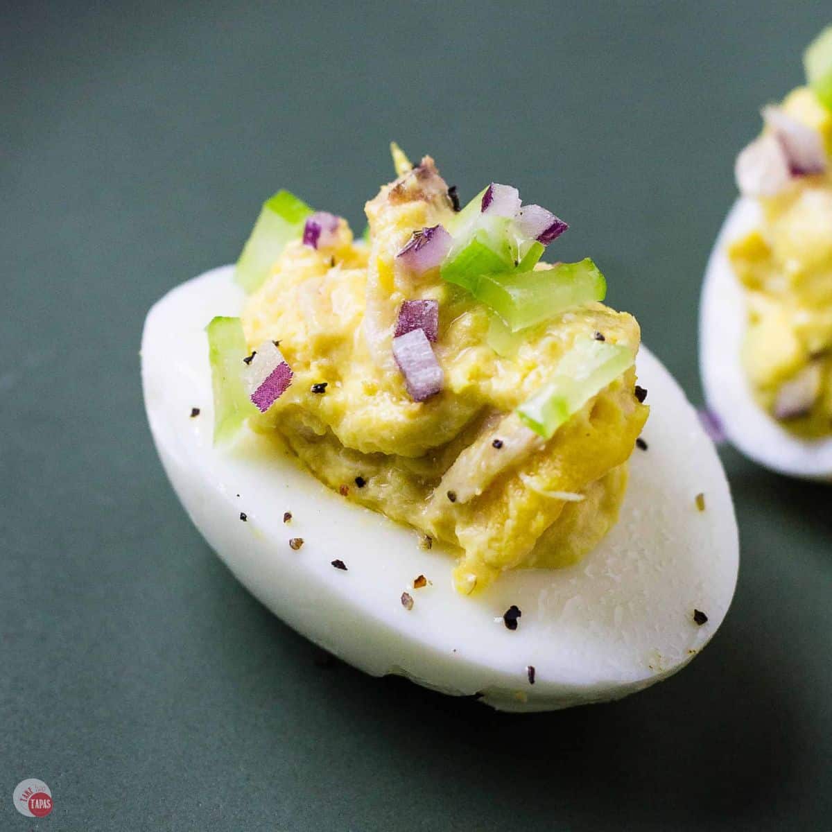 tuna deviled eggs on a green plate