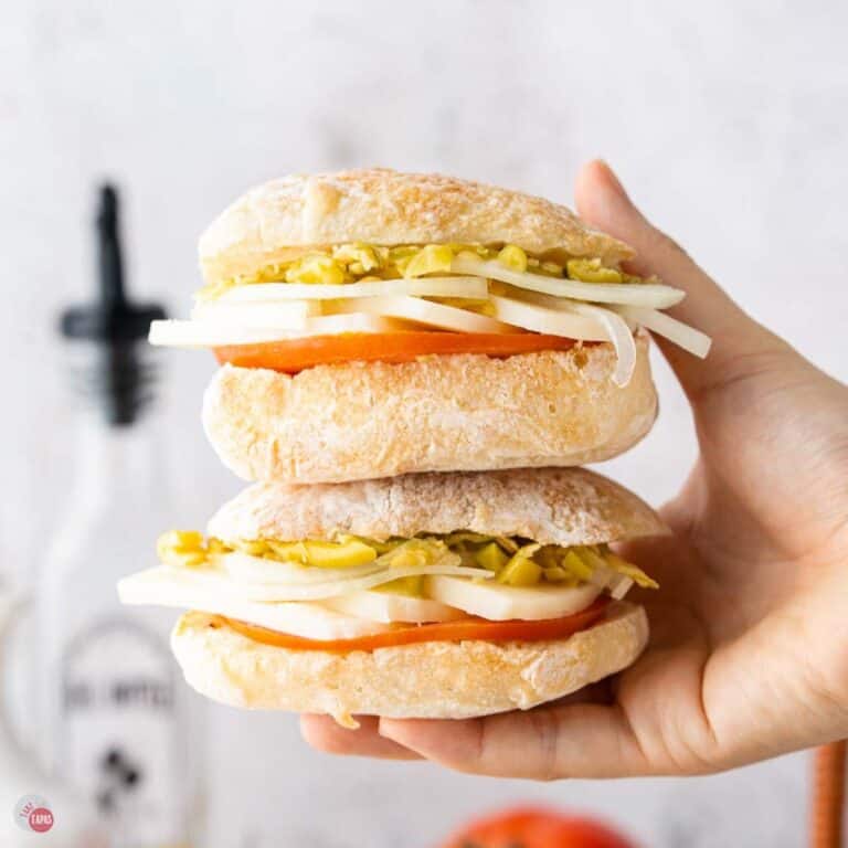 hand holding two vegetarian sliders