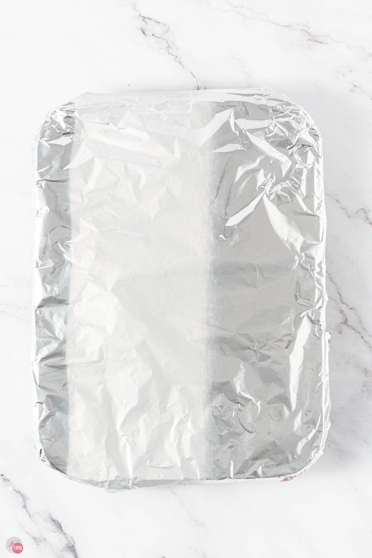 muffin pan covered in aluminum foil