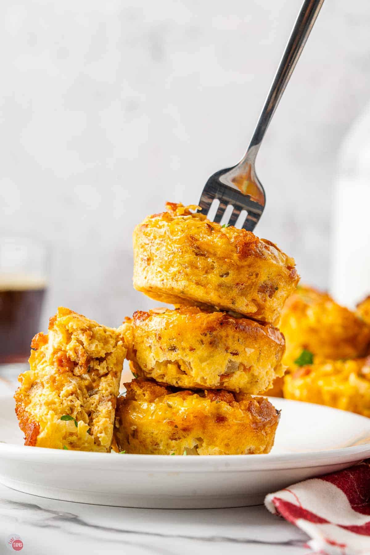 stack of breakfast casserole bites with a fork in them