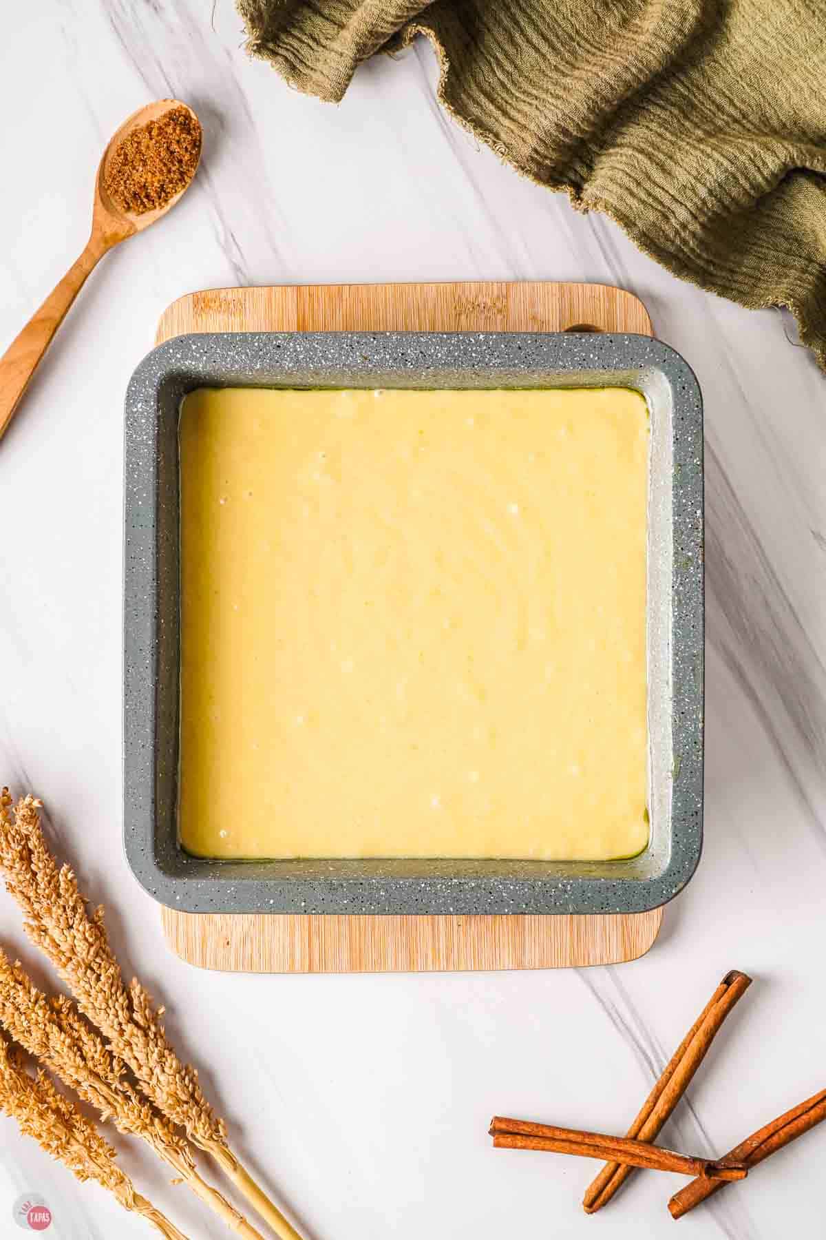 cake batter in a square baking pan