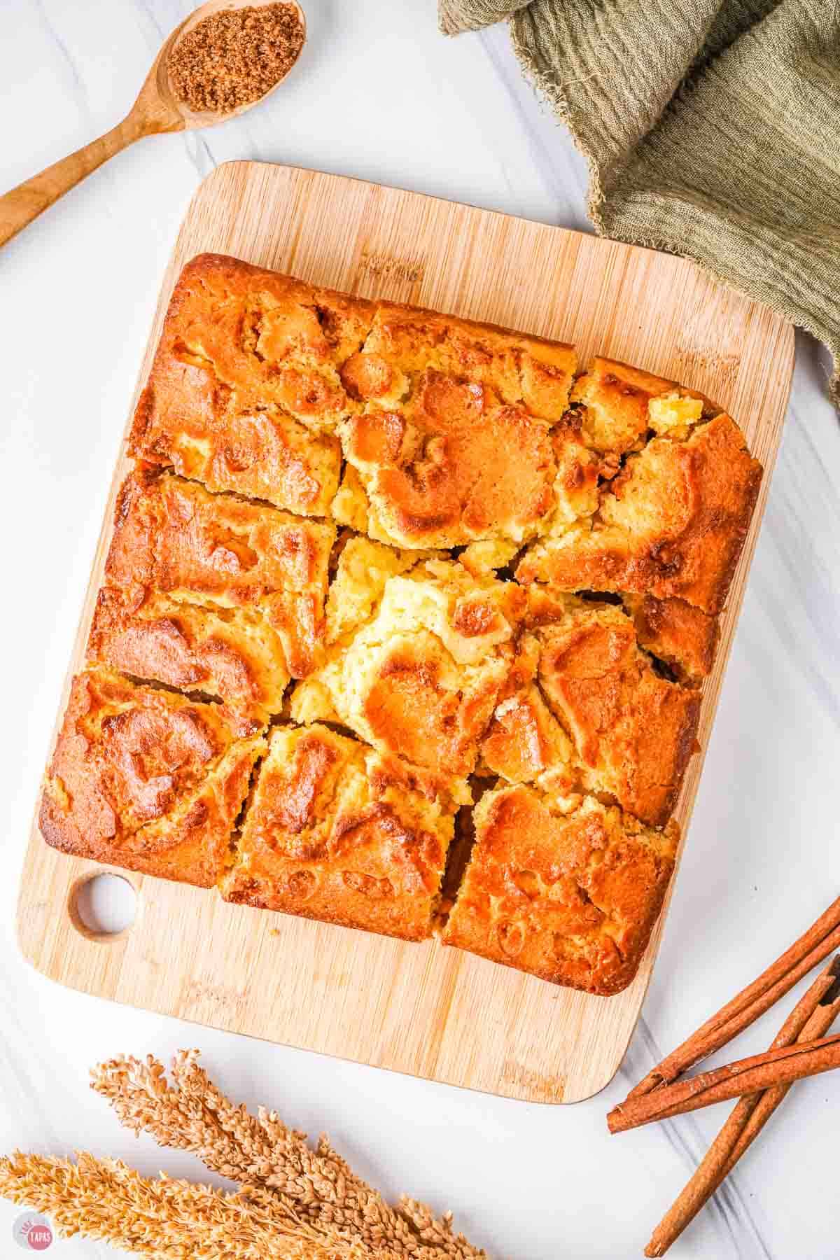 cake on a wood board cut into squares