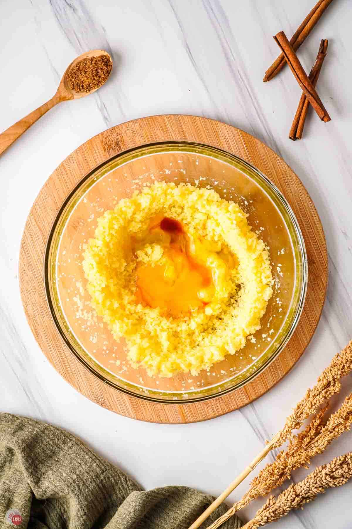 creamed butter and sugar in a clear bowl with eggs