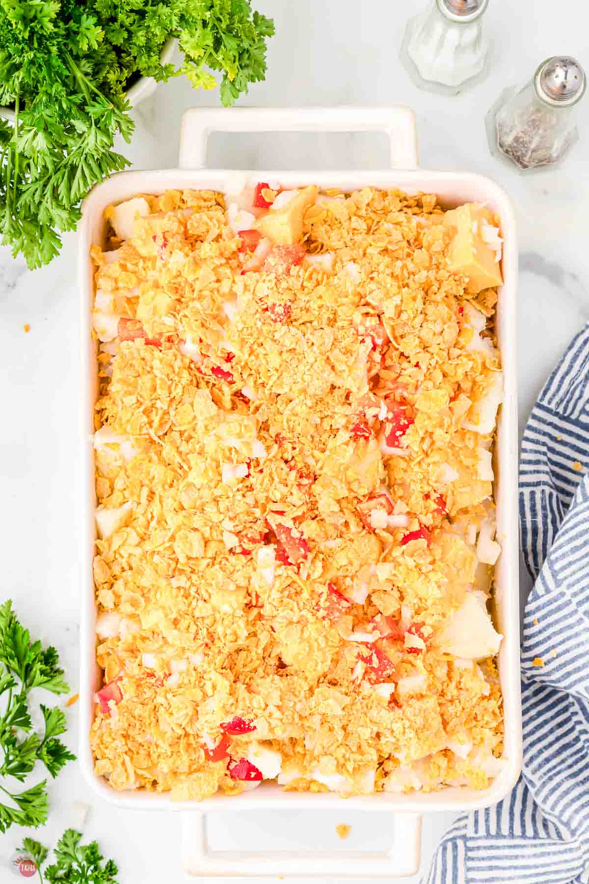 unbaked cottage potatoes in a white rectangle dish