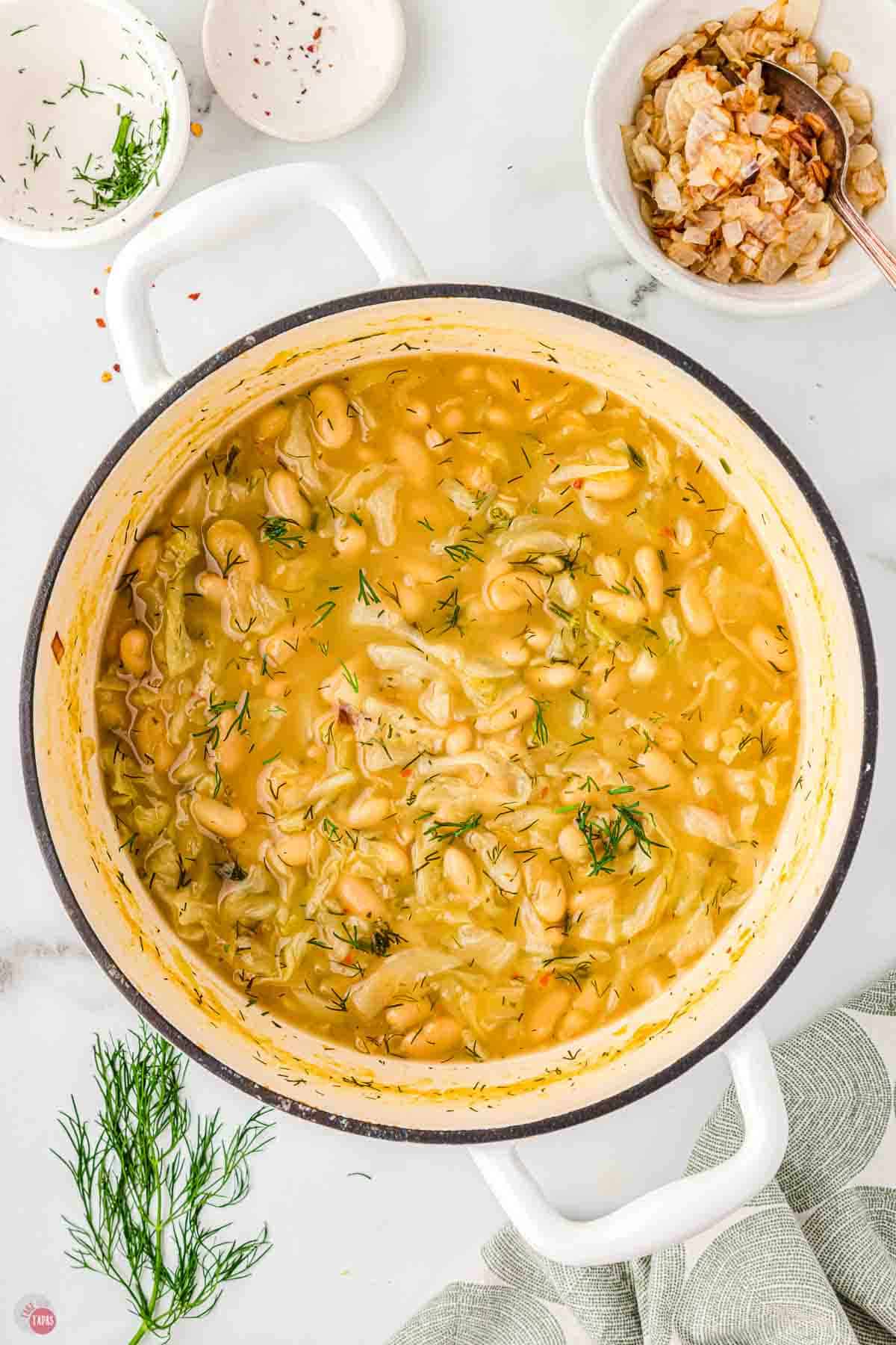 white soup pot full of cooked stew