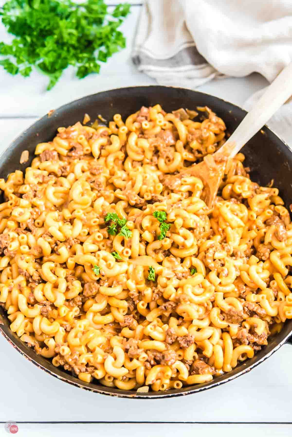 skillet of macaroni and hamburger in gravy