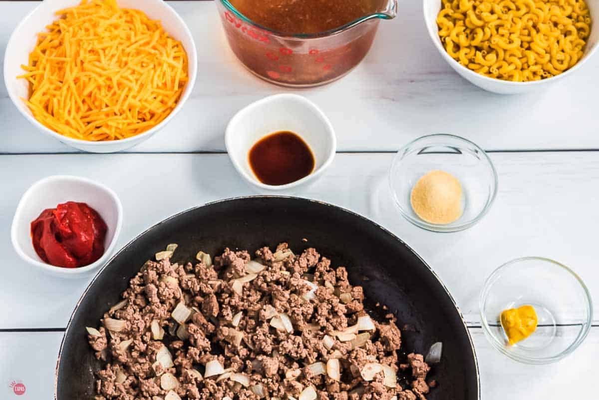 ground beef and onions cooking in a skillet