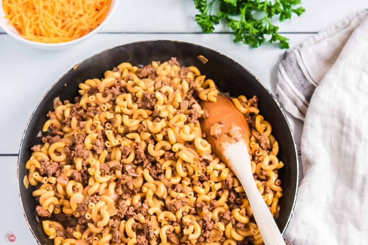 macaroni and ground beef in a skillet with sauce