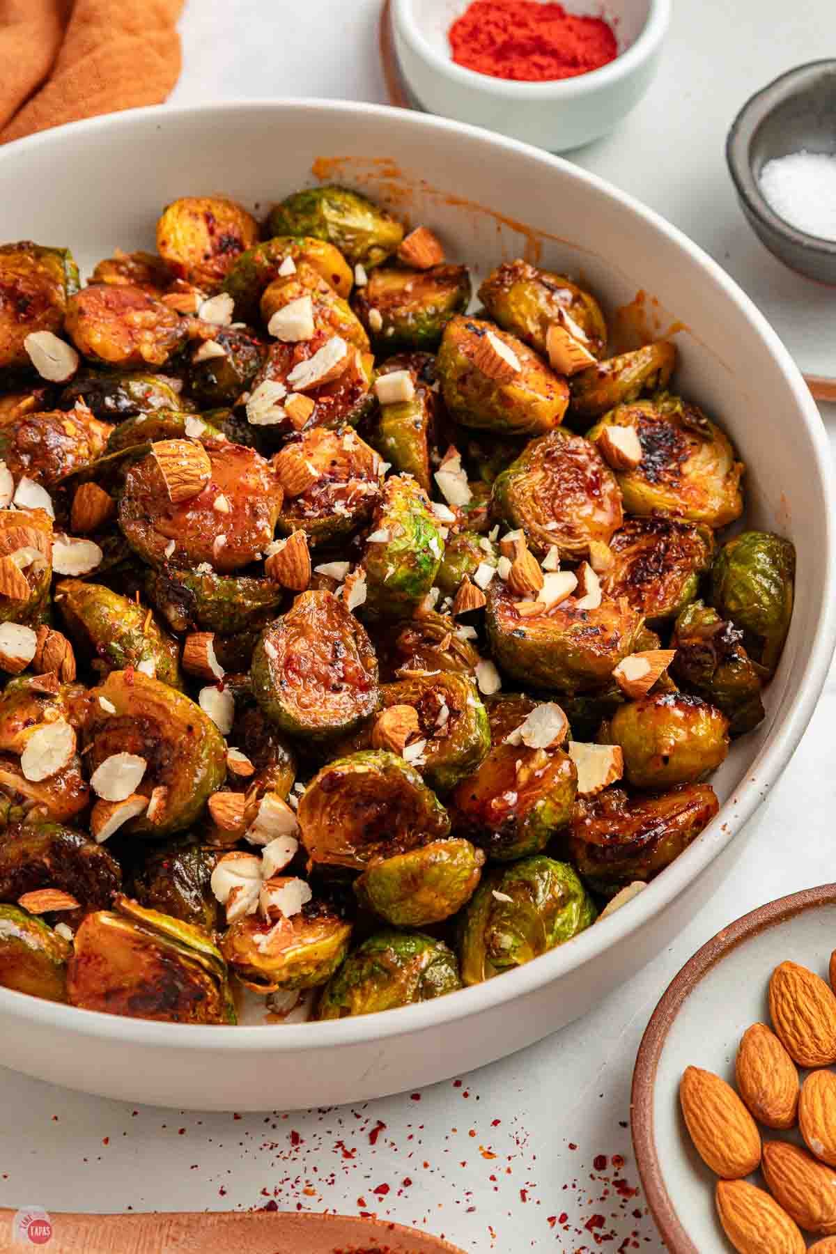 close up of Spicy Brussels sprouts in a white bowl
