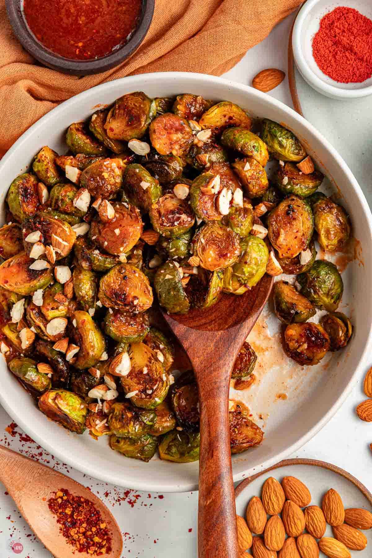 bowl of sprouts and wood spoon