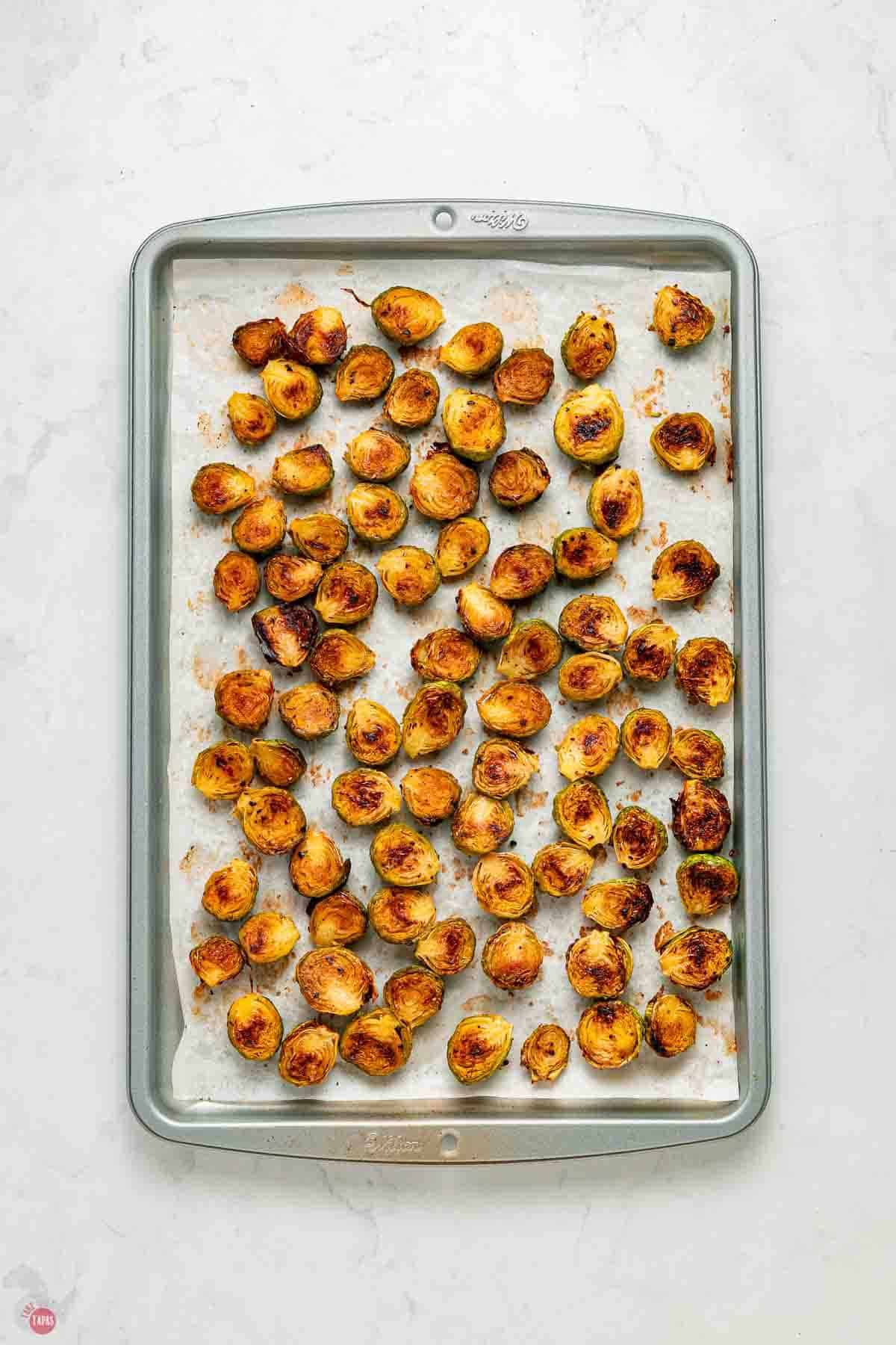 baking sheet covered with roasted Brussels sprouts on it