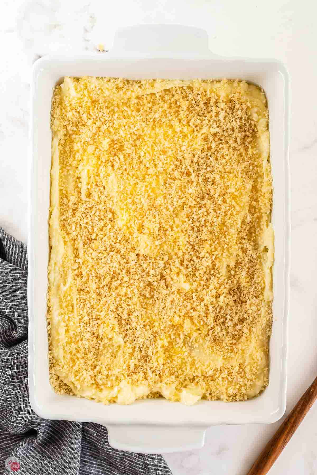 casserole dish with potatoes and a crunchy panko topping before baking
