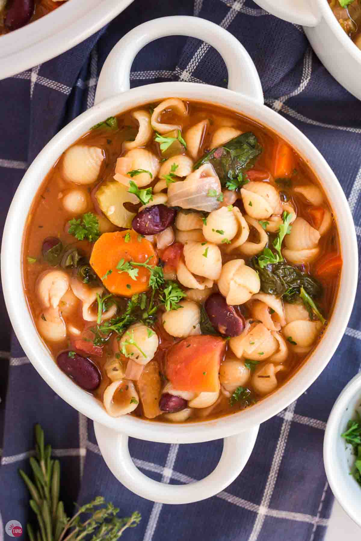bowl of Italian soup with a blue napkin