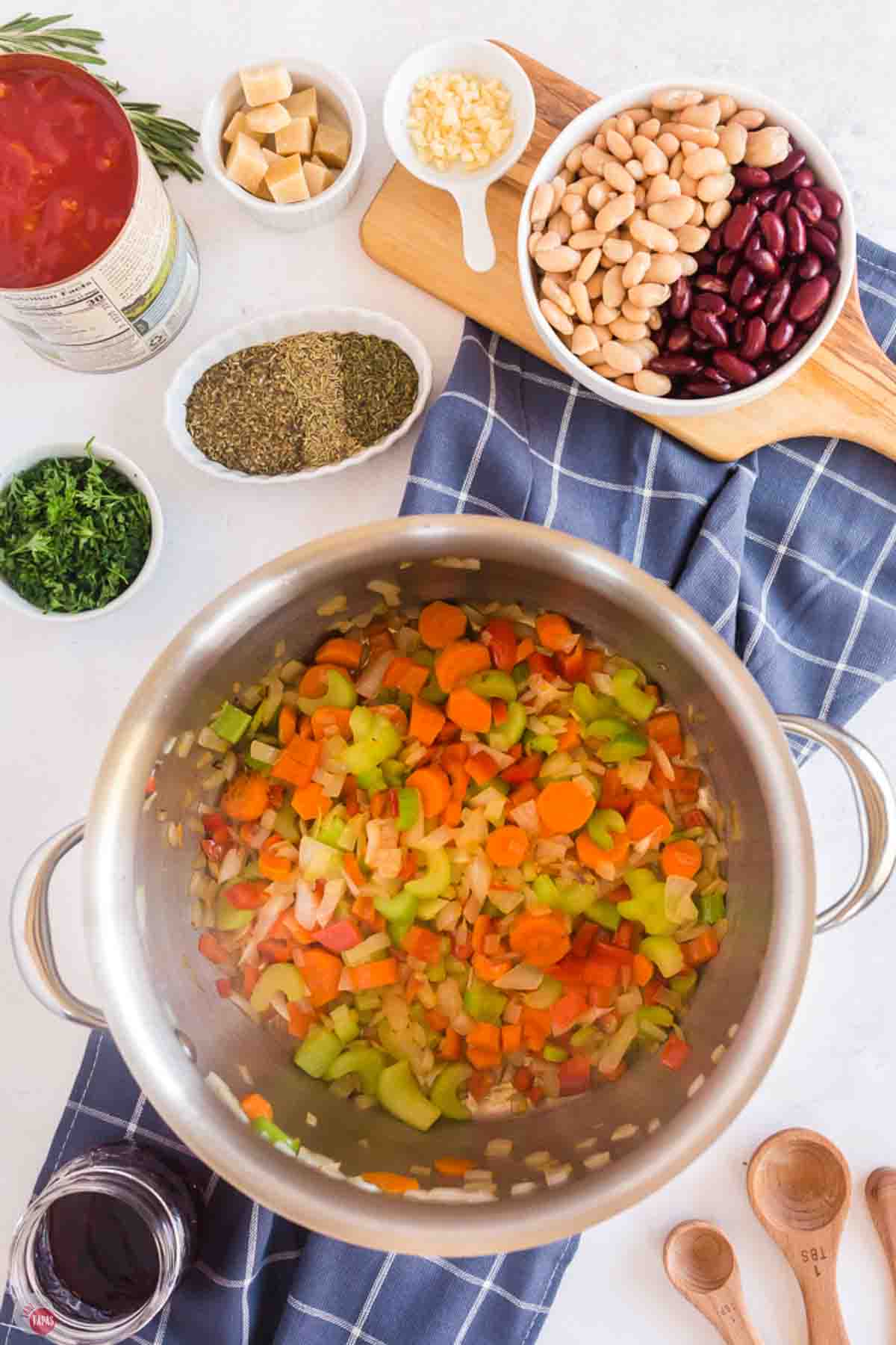 cooked vegetables in the bottom of a silver pot