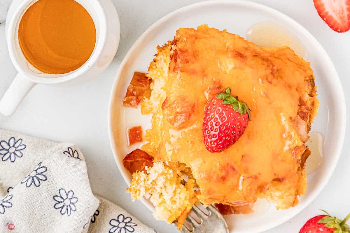 slice of casserole with syrup and fruit
